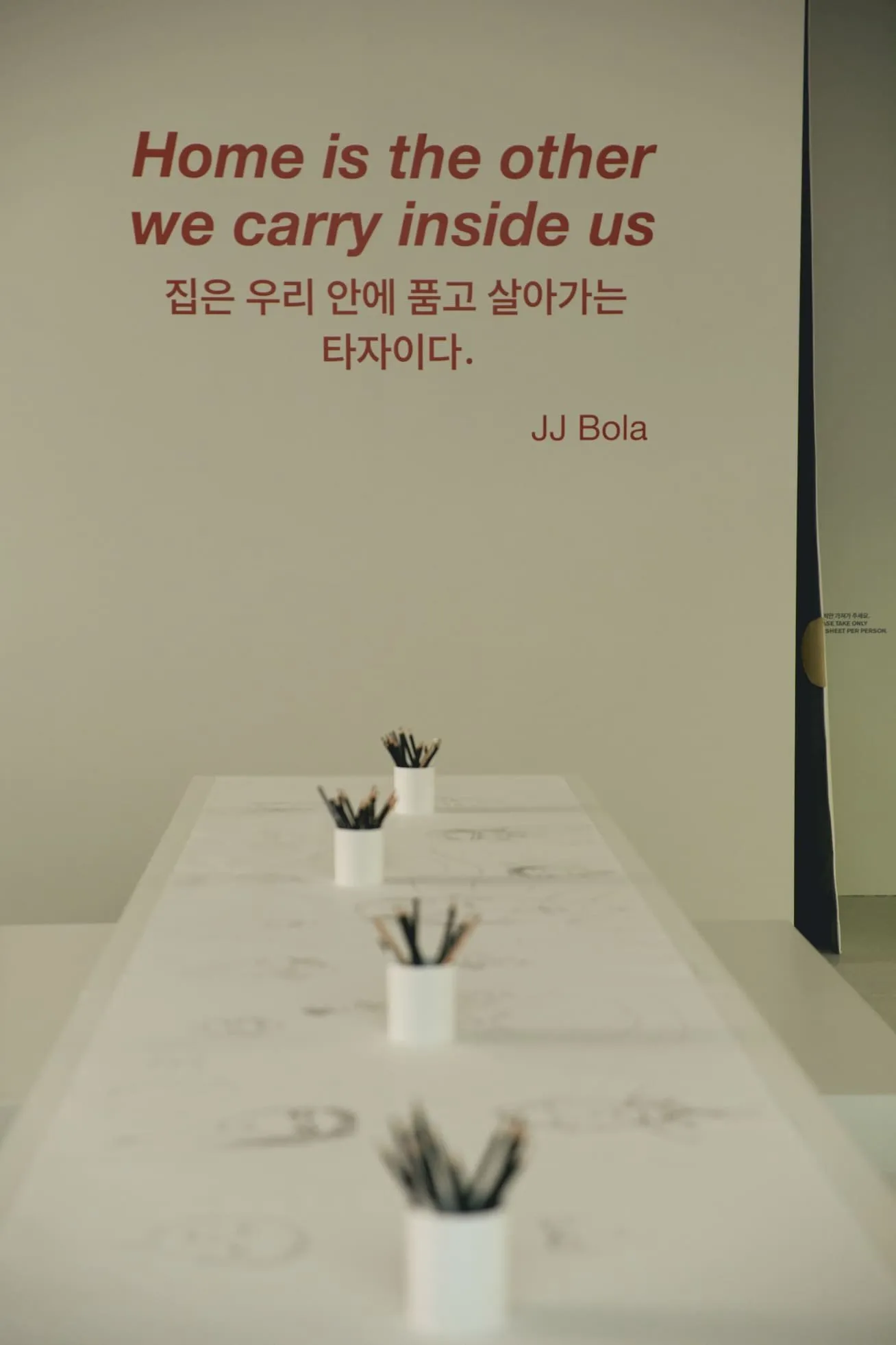 'Home is the other we carry inside us' — JJ Bola's line above the Collective Portrait drawing table